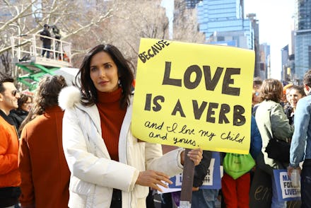 'Top Chef' star Padma Lakshmi holding a sign to show support for migrants at the border.