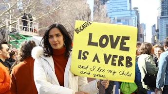 'Top Chef' star Padma Lakshmi holding a sign to show support for migrants at the border.