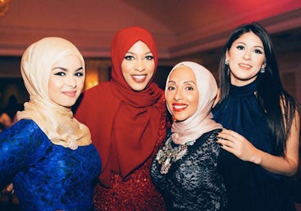 Four Muslim women in formal dresses, also wearing hijabs 