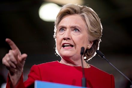 Hillary Clinton, giving a speech while pointing at something in the distance