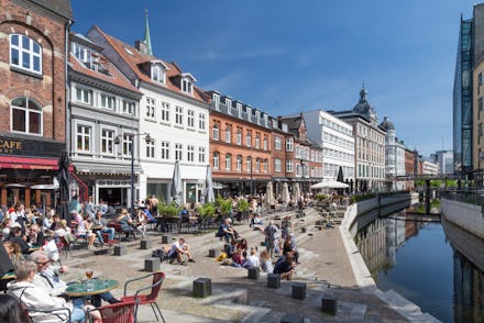A street with a row of buildings in Aarhus, Denmark