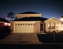 The outside of a family house during the evening 