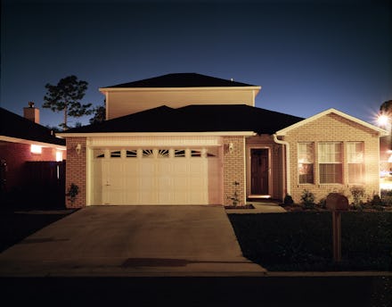 The outside of a family house during the evening