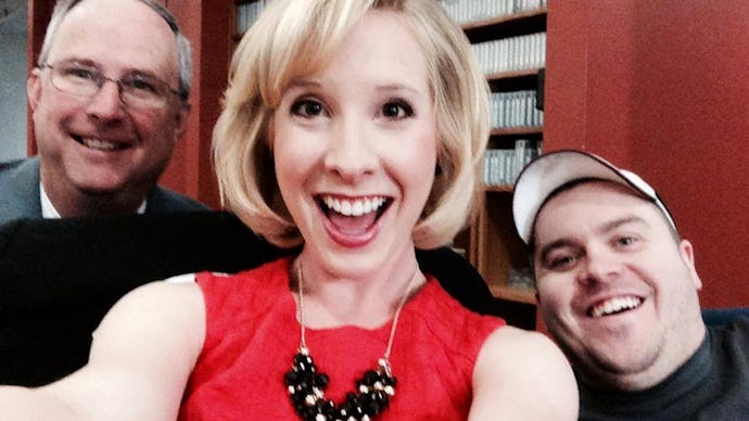 Late Alison Parker and Adam Ward taking a selfie with a man standing next to them