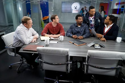 A scene with a group of men sitting at a table in 'Black-ish' season 3, episode 4