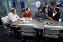 A scene with a group of men sitting at a table in 'Black-ish' season 3, episode 4