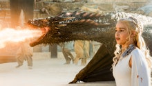 Emilia Clarke in a Game of Thrones scene with a dragon 