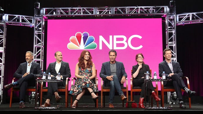 the cast of ‘Will & Grace’ sitting on a panel in front of the nbc logo