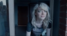 Emma stone, sitting on the stairs in front of a house, a scene from Birdman.