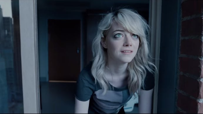 Emma stone, sitting on the stairs in front of a house, a scene from Birdman.