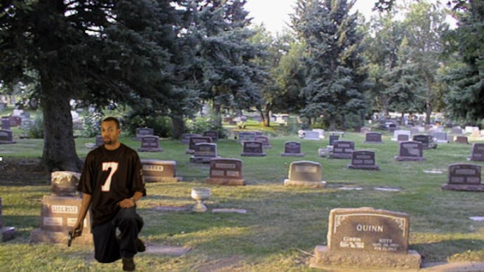 A photoshop image with a racist image of a man of a graveyard