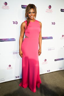 Laverne Cox posing in a pink dress