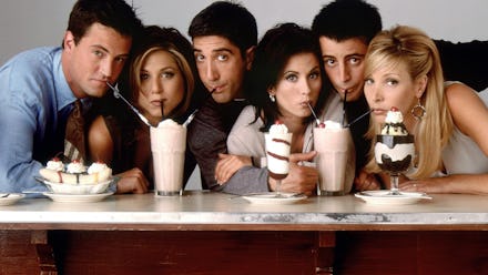 The 'Friends' cast sitting together and drinking smoothies
