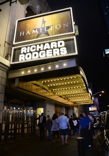 The entrance of the Broadway in New York City with a Hamilton poster
