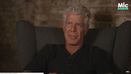 Anthony Bourdain sitting during an interview