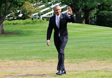 Barack Obama walking and waving to people