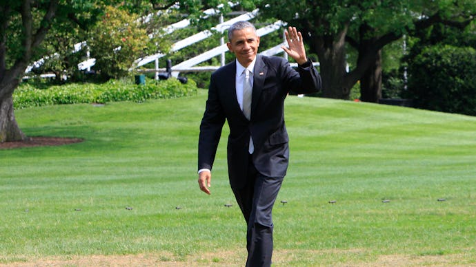 Barack Obama walking and waving to people