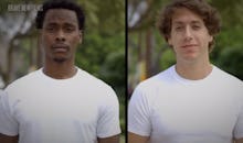 A white and black man standing next to each other in identical white shirts