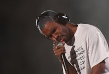 Frank Ocean in a white shirt performing on stage