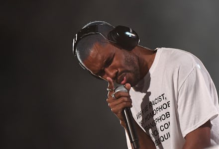 Frank Ocean in a white shirt performing on stage