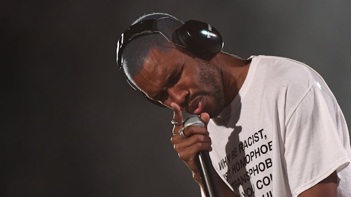 Frank Ocean in a white shirt performing on stage