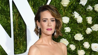 Sarah Paulson in a white evening dress at a red carpet event