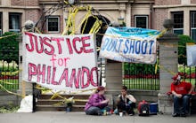 Protest banner with "Justice for Philando" text on the street