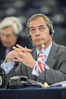 François Fillon sitting with headphones