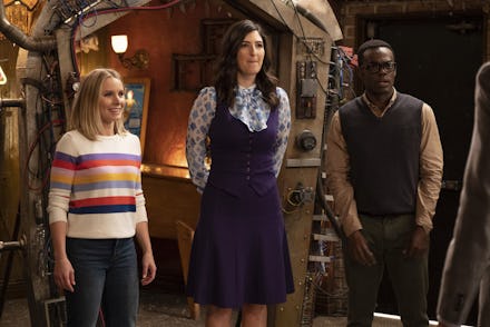 Eleanor, Chidi and Janet standing next to each other in an episode of the good place