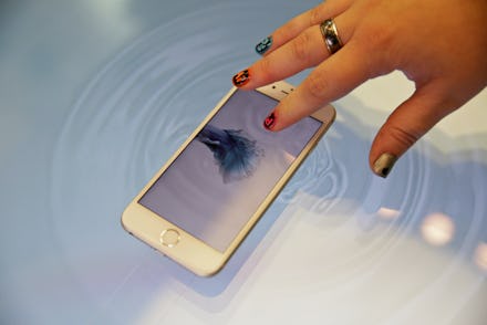 A woman using a birth control app on her mobile phone