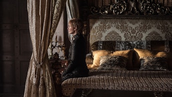 Still from the game of thrones episode eastwatch featuring cersei baratheon sitting on a bed