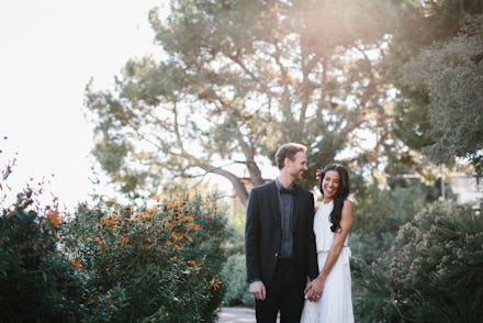 Groom wearing Lululemon and posing with the bride