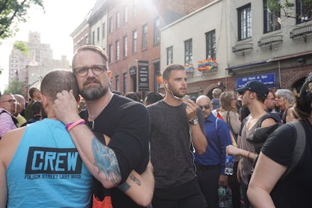 People standing outside in mourning after the Orlando Club Massacre