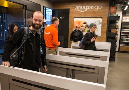 People walking around at a cashless Amazon Go store 