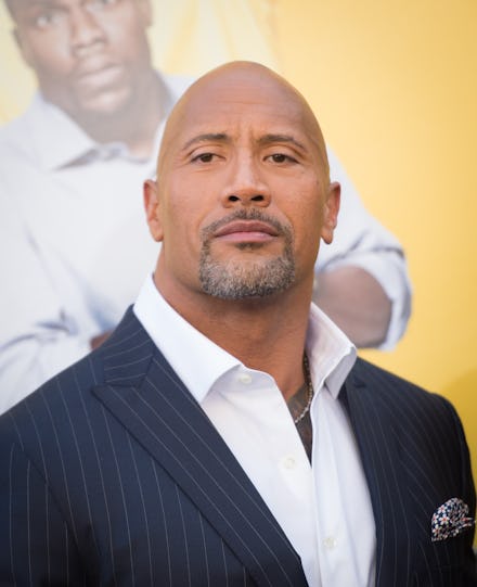 Dwayne Johnson in a black suit, and a white shirt