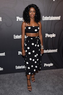 Javicia Leslie posing in a polka-dotted crop top and skirt set 