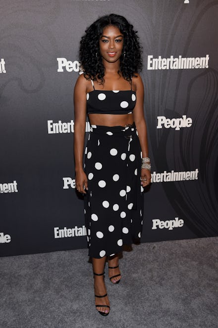 Javicia Leslie posing in a polka-dotted crop top and skirt set