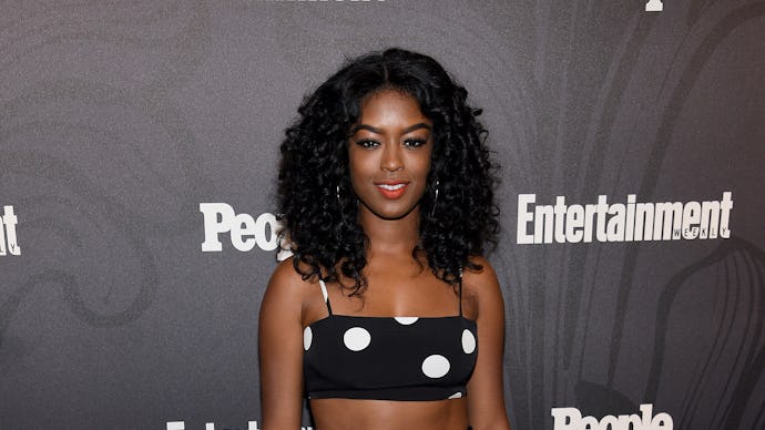 Javicia Leslie posing in a polka-dotted crop top and skirt set 