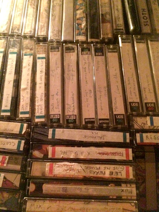 A lot of cassette tapes stacked next to each other