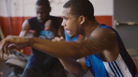Carlo Sweeney aka Coach Kali during a training session in a blue-white shirt
