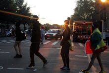 People walking down a street for Ann Marie justice