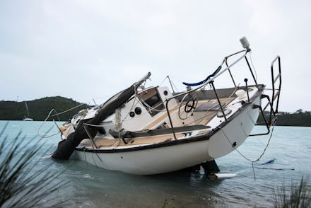 A tilted, sinking boat after hurricane Nicole in 2016