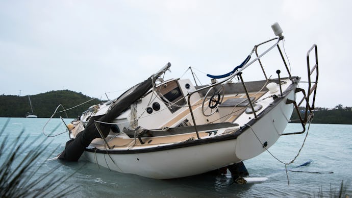 A tilted, sinking boat after hurricane Nicole in 2016