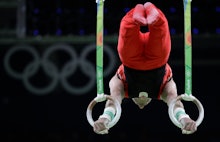 A participant the the Rio Olympics 2016 balancing on two ring