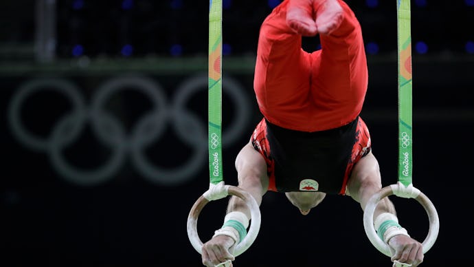 A participant the the Rio Olympics 2016 balancing on two ring