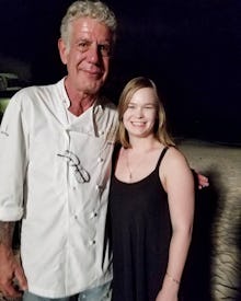 Katie Lockhart standing next to Anthony Bourdain, who inspired her to move across the world