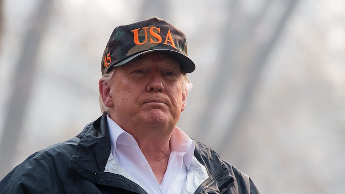 Donald Trump wearing a USA cap looking into the distance