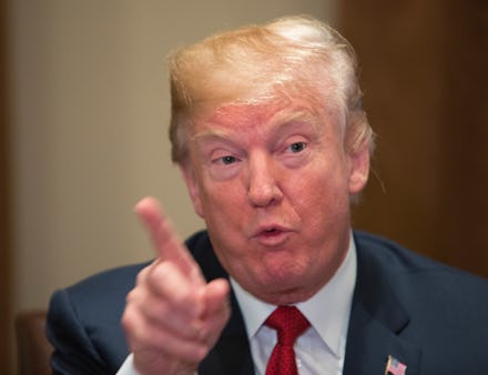 A closeup of Donald Trump speaking, pointing with his index finger