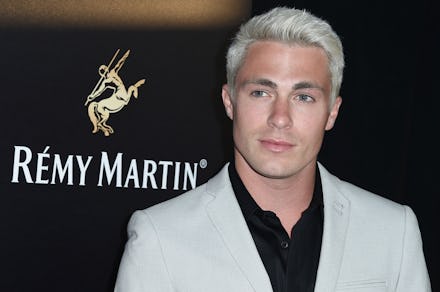 Colton Haynes in a white blazer and black button-up