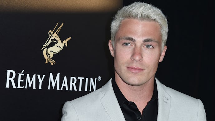 Colton Haynes in a white blazer and black button-up